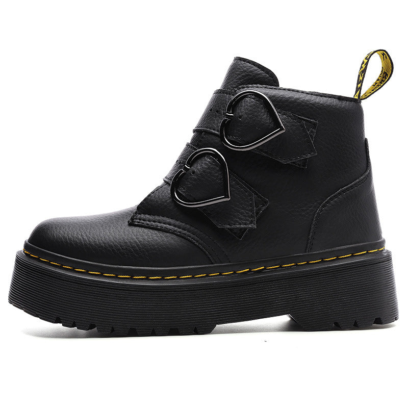 Black leather boot with heart-shaped buckles on a white background