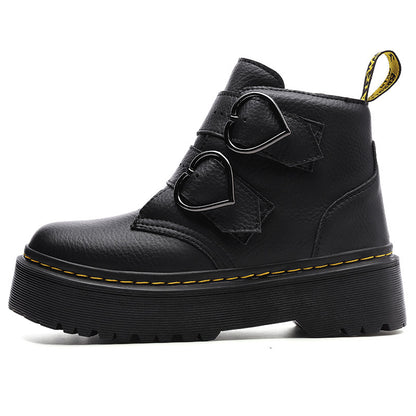 Black leather boot with heart-shaped buckles on a white background