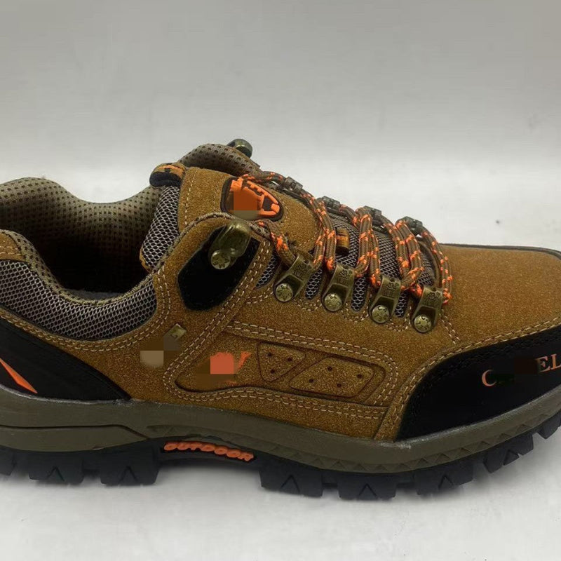 Brown hiking shoe with orange accents on a white background
