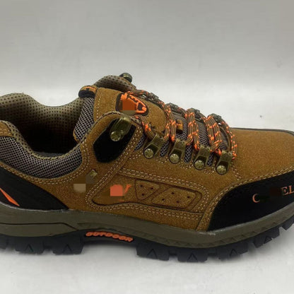 Brown hiking shoe with orange accents on a white background