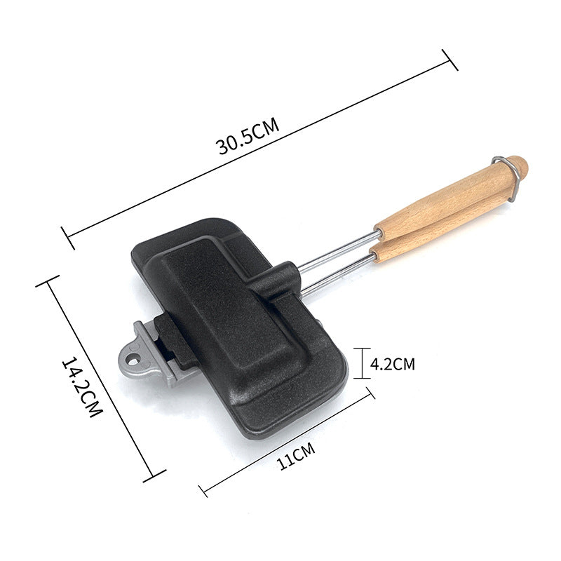 Black kitchen tool with wooden handle and measurements on a white background