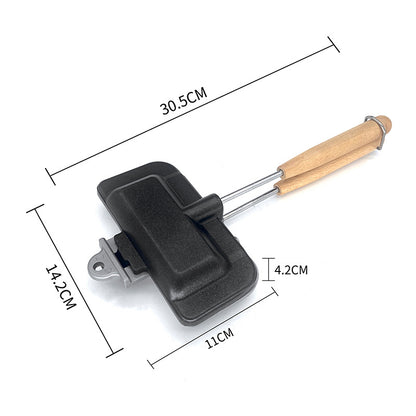Black kitchen tool with wooden handle and measurements on a white background