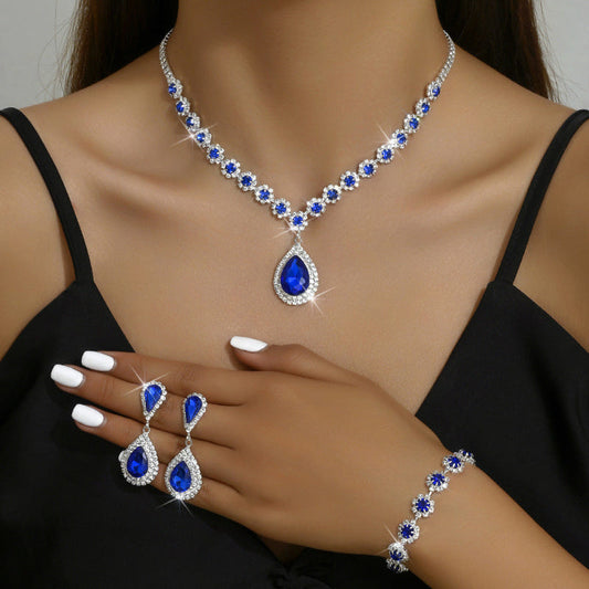 Rhinestone bridal jewelry set: blue teardrop necklace, matching earrings and bracelet