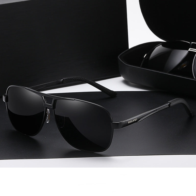 Black frame sunglasses with gray film on a black background