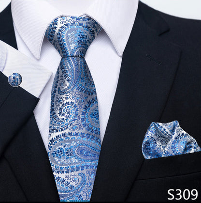 Blue paisley tie and pocket square set with black suit and white shirt