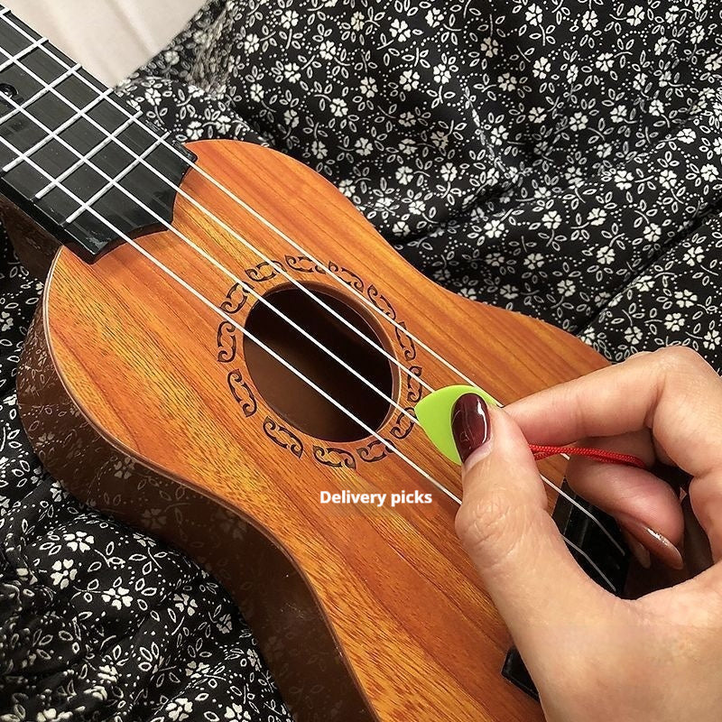 Person changing a ukulele string with a green string winder on a black floral background
