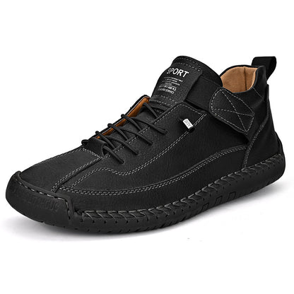 Men's mid-top leather lace-up shoe in black with padded collar and textured rubber outsole.