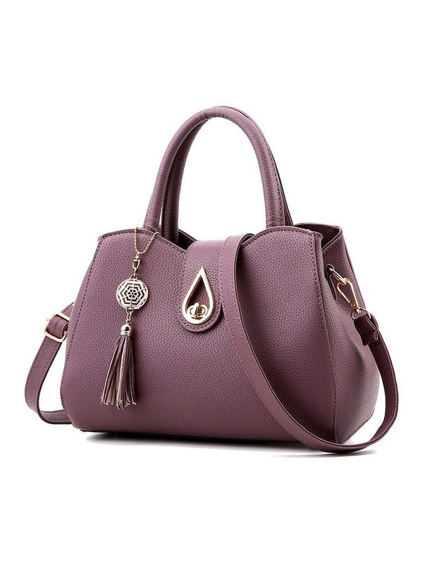 Women’s PU leather handbag, purple, top handles and crossbody strap, front tassel and clasp