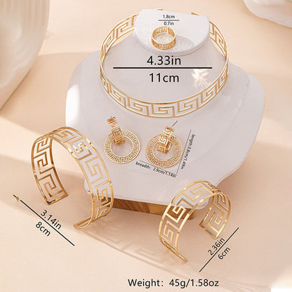 Gold jewelry set including bracelet, ring, and earrings on a white stand with measurements.