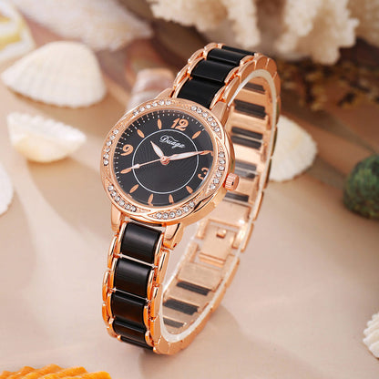 Rose gold round quartz wristwatch with dark dial and black link bracelet