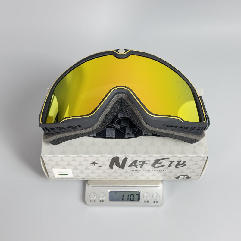 Goggles with yellow lenses on a Nafeib branded box with a digital scale displaying weight.