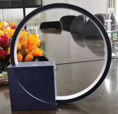 Modern decorative piece with a circular design on a reflective surface