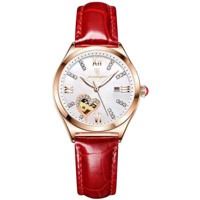 Wristwatch with red leather strap and rose gold case on white background
