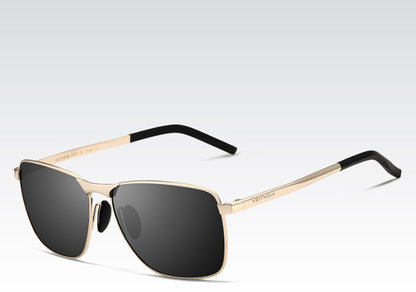Sunglasses with gold frame and black lenses on a white background