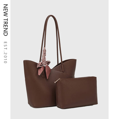 Brown handbag with matching pouch on a light gray background, featuring 'NEW TREND' branding.
