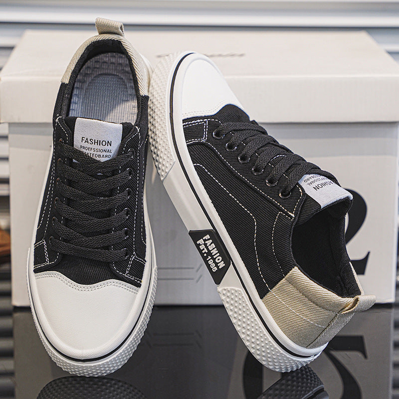 Black and white sneakers on a reflective surface with a blurred background