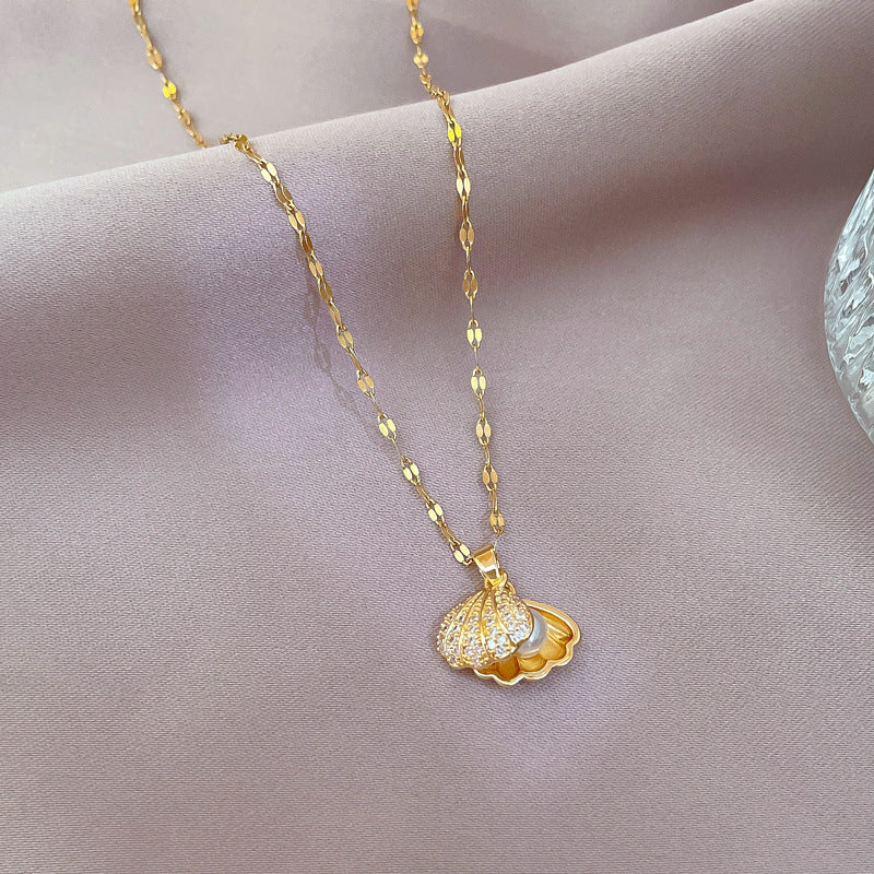 Women's Gold necklace with a heart-shaped pendant on a soft pink background