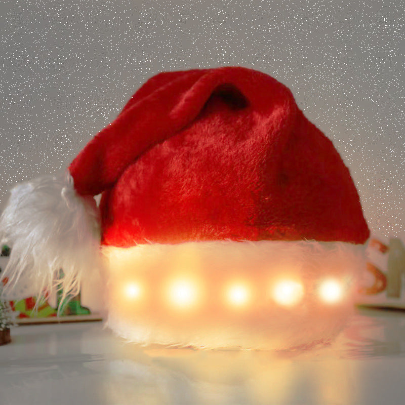 Red Santa hat with LED lights on a gray background