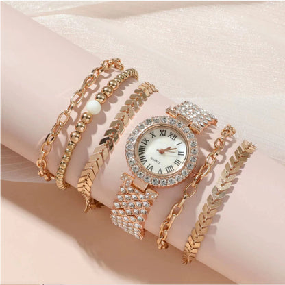 Rose gold watch and bracelet set on a soft pink background
