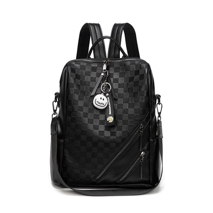 Black checkered backpack with a keychain on a white background