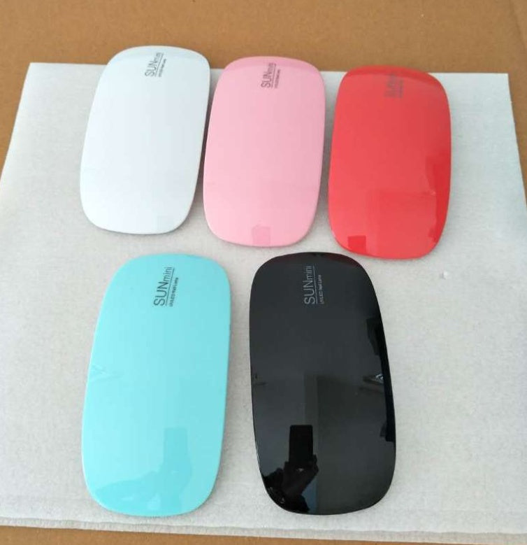 Five colorful Nail Drayer on a white paper background.