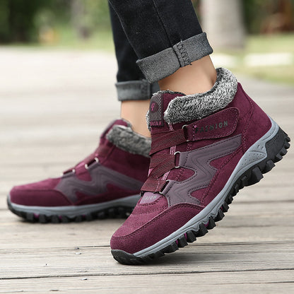 Mid-cut casual sports shoes with thick sole, burgundy upper with fuzzy lining and tread sole.