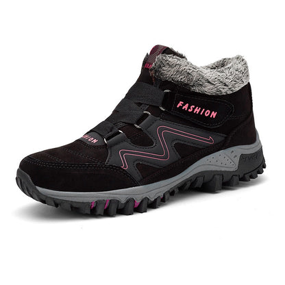 Mid-cut casual sports shoes with thick sole, dark brown upper with pink trim and fuzzy collar.