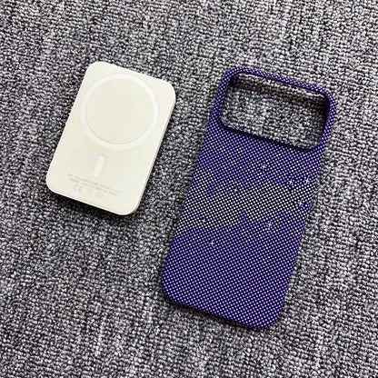 White electronic device and purple mesh pouch on a gray textured surface