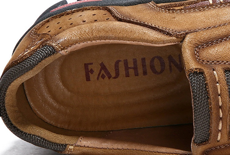Close-up of a brown shoe with 'FASHION' embossed on the sole.