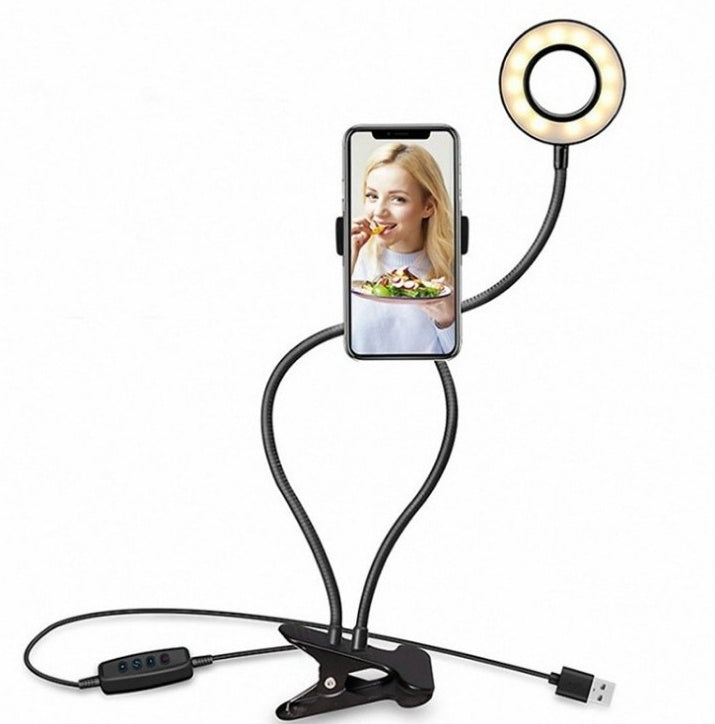 LED selfie ring light with phone holder and tripod-style base on adjustable stand