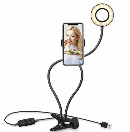 LED selfie ring light with phone holder and tripod-style base on adjustable stand