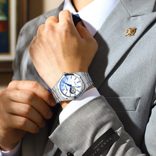 Stainless steel mechanical watch with blue dial and metal bracelet, butterfly buckle clasp