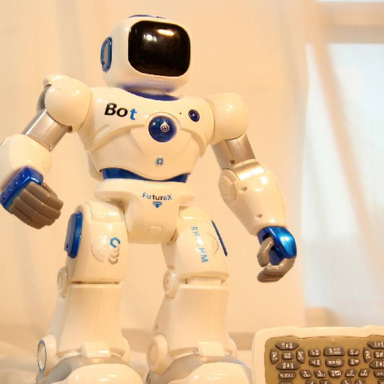 White robot toy with 'Bot' and 'FutureX' branding on a light background