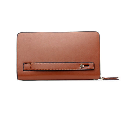 Brown leather mobile phone handbag with flap, slim wrist strap, and zipper closure