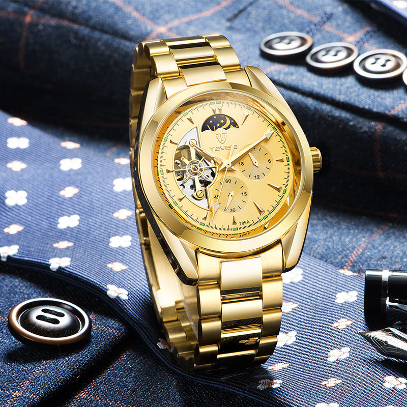 Gold mechanical tourbillon watch with champagne dial and gold metal link bracelet