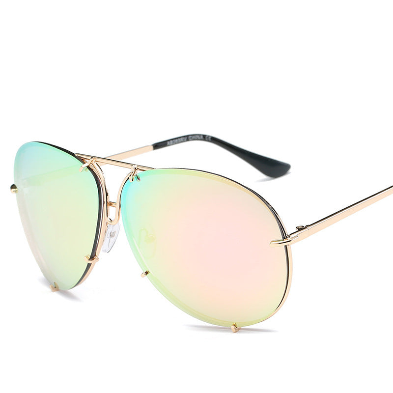Sunglasses with gold frame and multicolored lenses on a white background