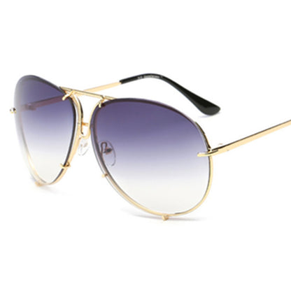 Gold-framed sunglasses with gradient purple lenses on a white background