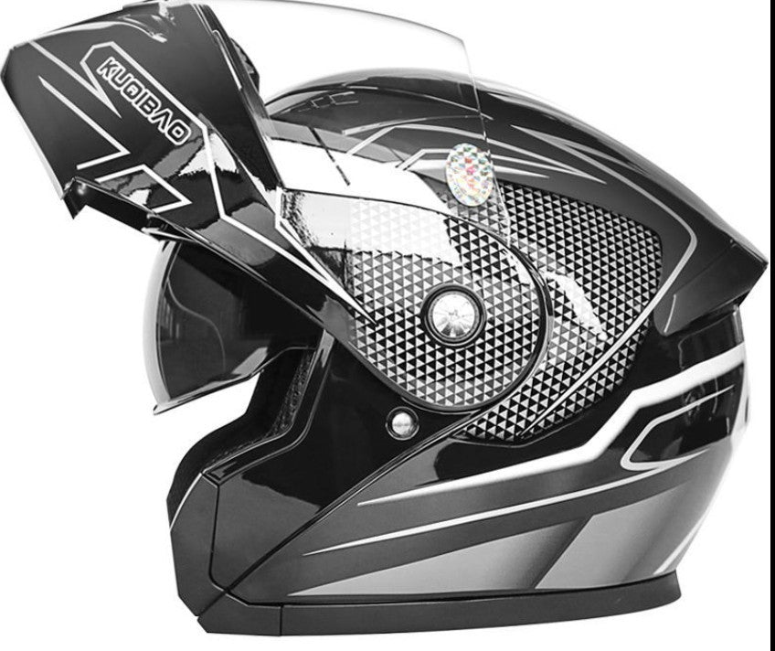Black and silver motorcycle helmet with visible branding. YAXSO UAE ONLINE STORE