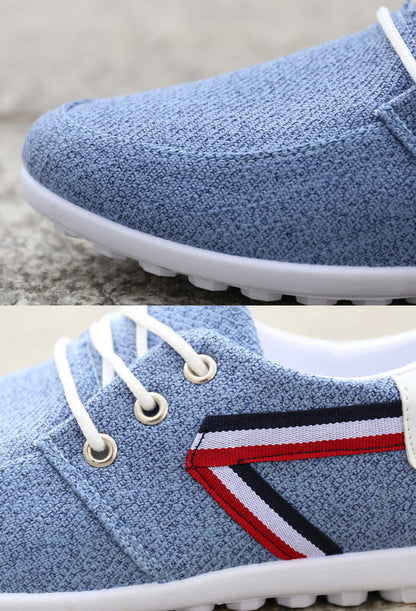 Blue canvas lace-up shoes with striped side panel, white rubber sole