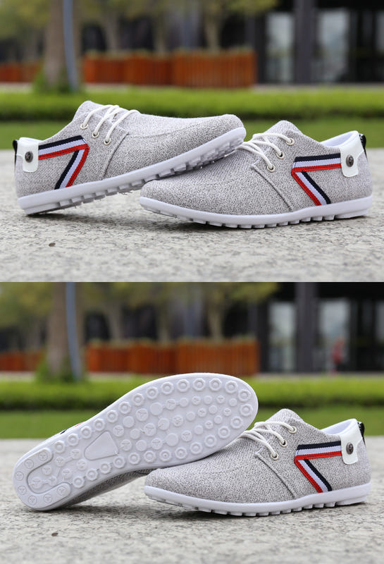 Grey canvas lace-up shoes with striped side panels and white rubber tread sole
