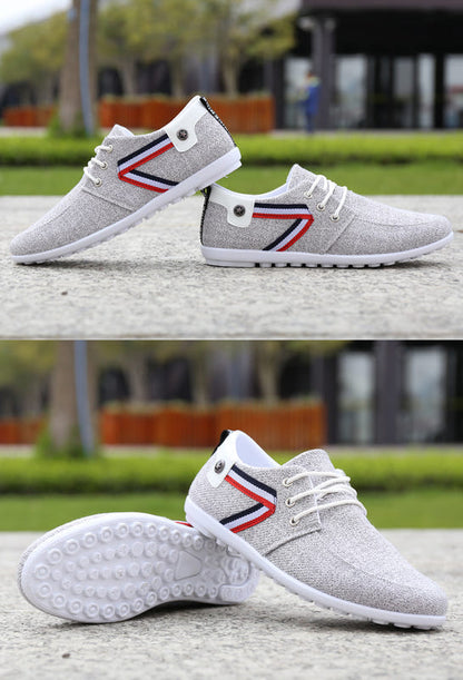 Grey canvas lace-up shoes with striped side panels and textured outsole