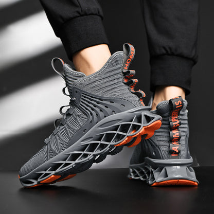 Gray sneakers with orange accents worn by a person on a dark background