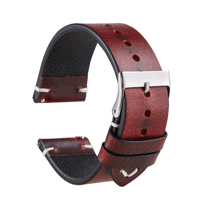 Wine red leather strap with silver buckle and visible side stitching