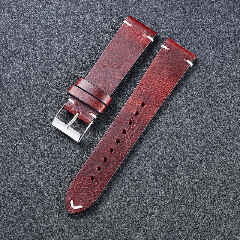 Thin wine red leather watch strap with silver buckle and perforation holes
