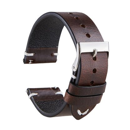 Thin brown leather watch strap with silver buckle and adjustment holes