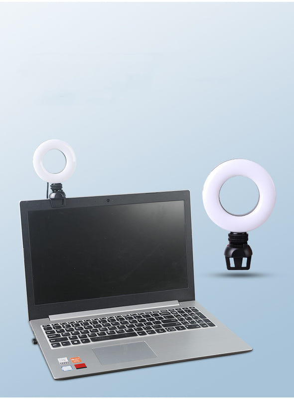 Dual USB round LED selfie lights with white rings on a laptop