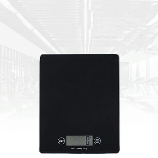 Black digital kitchen scale on a white background