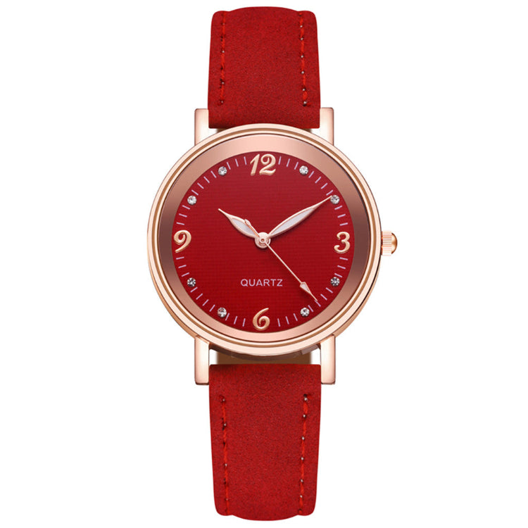 Red watch with a red strap on a white background