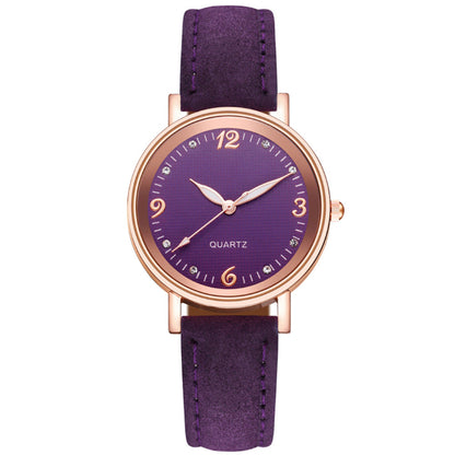 Purple watch with rose gold case and strap on a white background