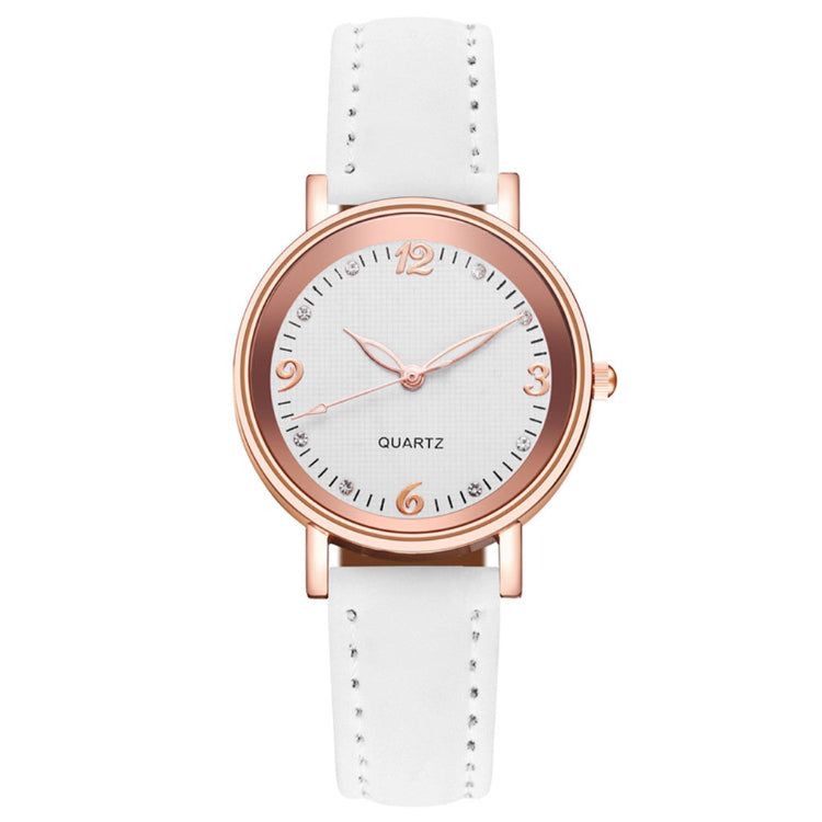 White watch with rose gold case and strap on a white background